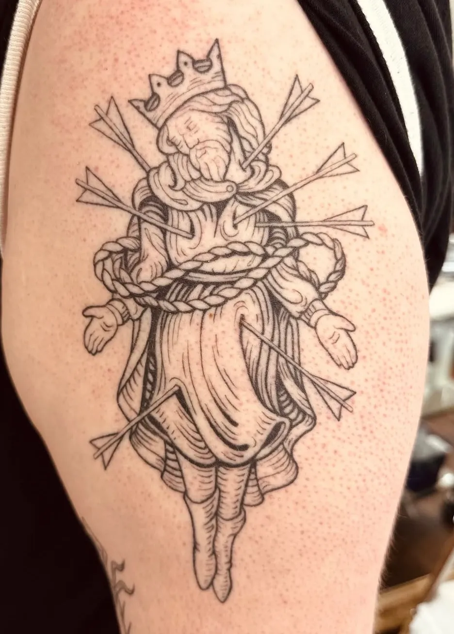 Crowned martyr king pierced with arrows, medieval linework upper arm tattoo by Hannah at Shade Studio Peterborough