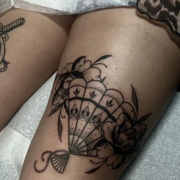 blackwork folding hand fan with peonies and stipple shading, above the knee, by ashlee at shade studio peterborough