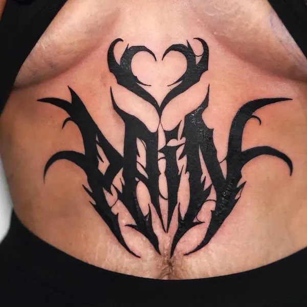 blackwork gothic "pain" lettering with a thorned heart, sternum piece, by cameron at shade studio peterborough