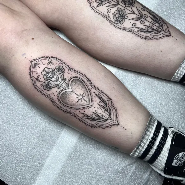 matching ornamental panels with lace edging, florals and a stipple-shaded heart, one on each lower leg, by ashlee at shade studio peterborough