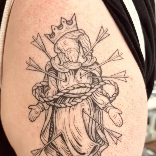 Crowned martyr king pierced with arrows, medieval linework upper arm tattoo by Hannah at Shade Studio Peterborough